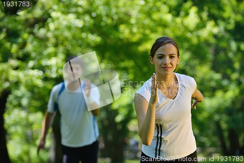 Image of Young couple jogging