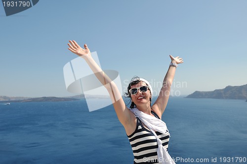 Image of Greek woman on the streets of Oia, Santorini, Greece