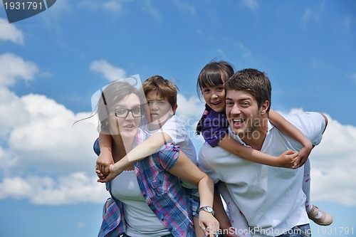 Image of happy young family have fun outdoors