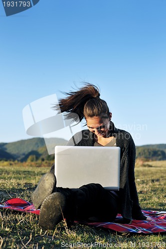 Image of young teen girl work on laptop outdoor