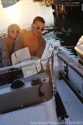 Image of couple in love  have romantic time on boat