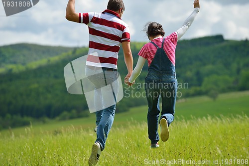 Image of romantic young couple in love together outdoor