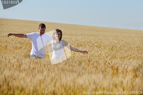 Image of happy couple in wheat field
