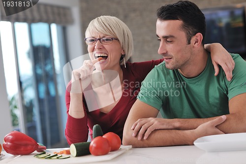 Image of young couple have fun in modern kitchen