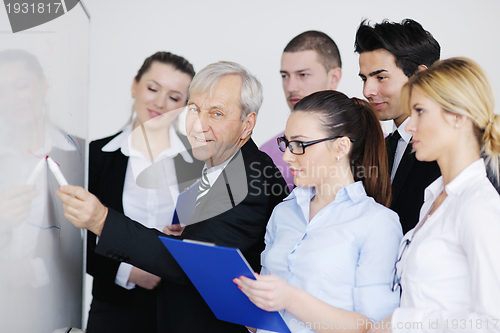 Image of Senior business man giving a presentation