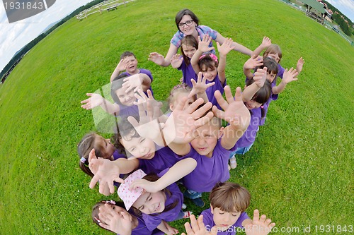 Image of happy kids group  have fun in nature