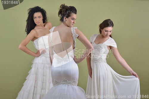 Image of portrait of a three beautiful woman in wedding dress