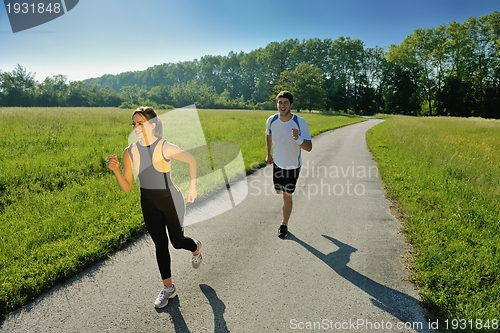 Image of Young couple jogging