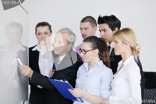 Image of Senior business man giving a presentation