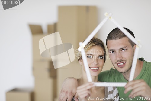 Image of Young couple moving in new home