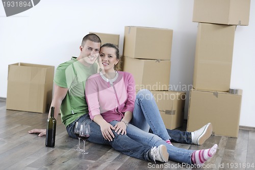 Image of Young couple moving in new home