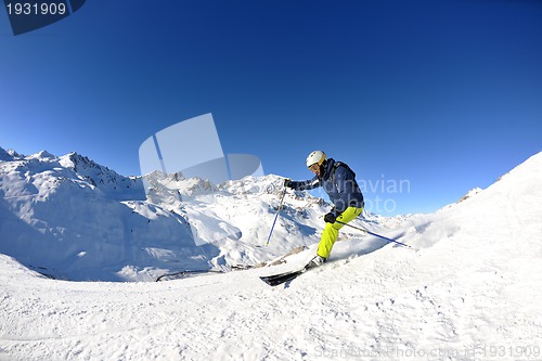 Image of skiing on fresh snow at winter season at beautiful sunny day