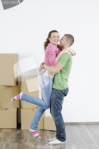 Image of Young couple moving in new home