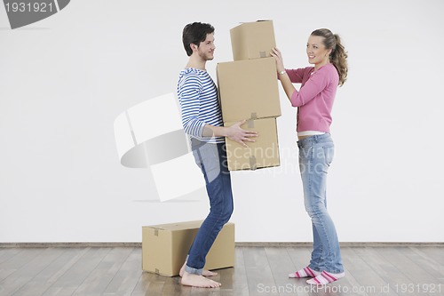 Image of Young couple moving in new home