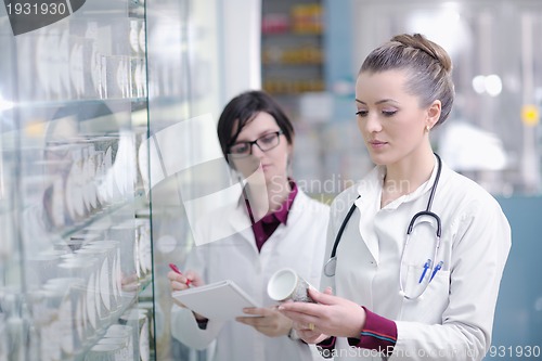 Image of team of pharmacist chemist woman  in pharmacy drugstore