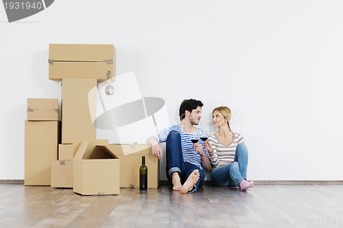 Image of Young couple moving in new house