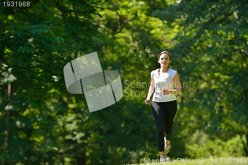 Image of Young couple jogging