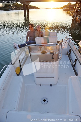 Image of couple in love  have romantic time on boat