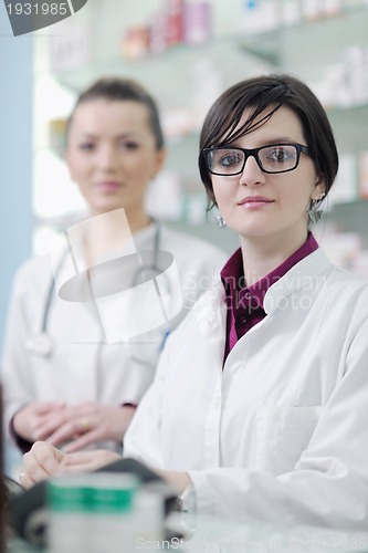 Image of team of pharmacist chemist woman  in pharmacy drugstore