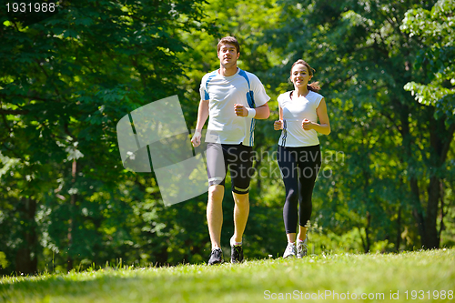 Image of Young couple jogging
