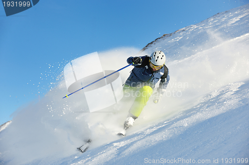 Image of skiing on fresh snow at winter season at beautiful sunny day