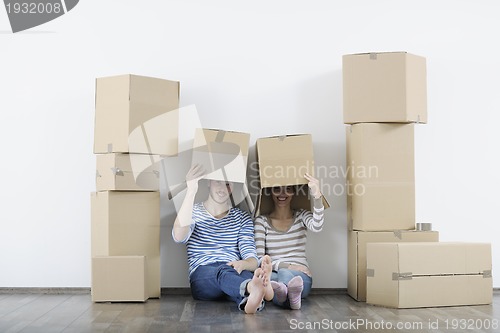 Image of Young couple moving in new home