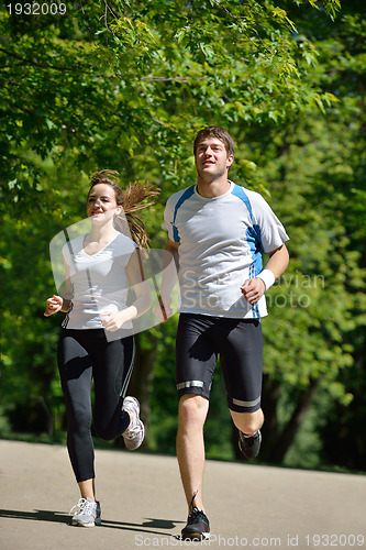 Image of Young couple jogging