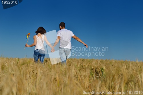 Image of happy couple in wheat field