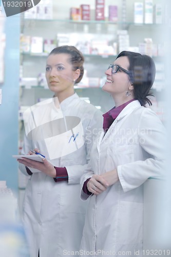 Image of team of pharmacist chemist woman  in pharmacy drugstore