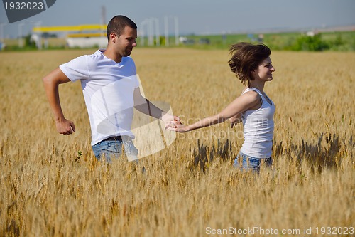 Image of happy couple in wheat field