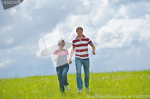 Image of romantic young couple in love together outdoor