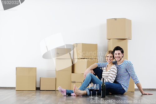 Image of Young couple moving in new house