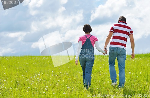 Image of romantic young couple in love together outdoor