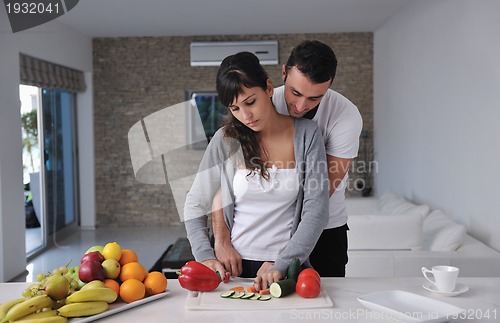 Image of young couple have fun in modern kitchen