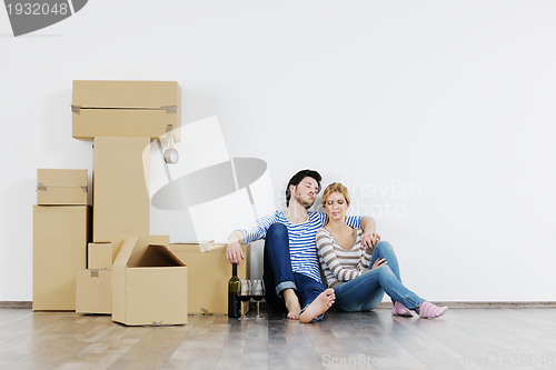 Image of Young couple moving in new house