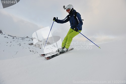 Image of skiing on fresh snow at winter season at beautiful sunny day