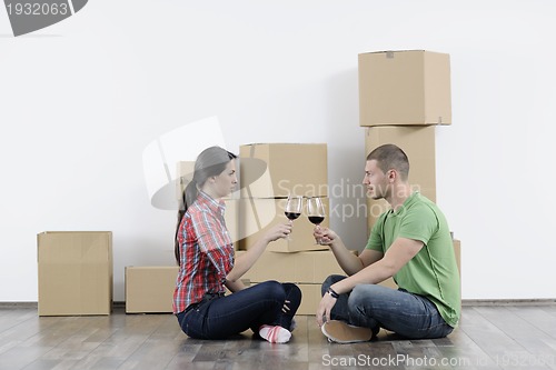 Image of Young couple moving in new home