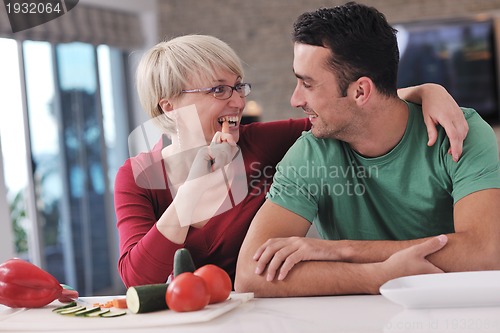 Image of young couple have fun in modern kitchen