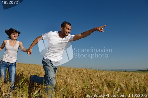 Image of happy couple in wheat field