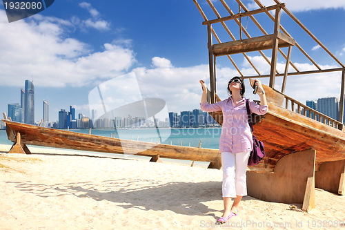 Image of happy tourist woman