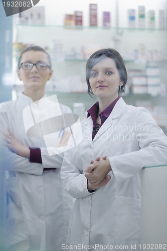 Image of team of pharmacist chemist woman  in pharmacy drugstore