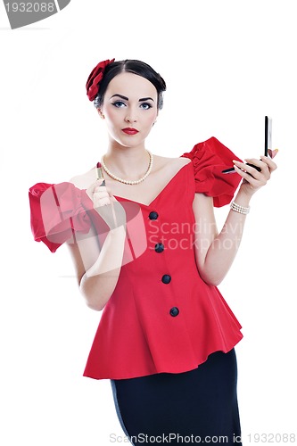 Image of beautiful young woman applying makeup