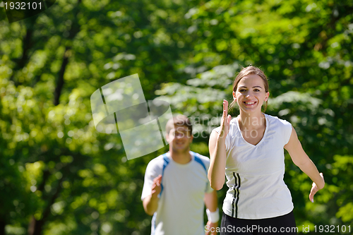 Image of Young couple jogging