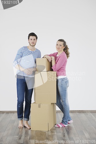 Image of Young couple moving in new home