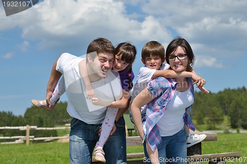 Image of happy young family have fun outdoors