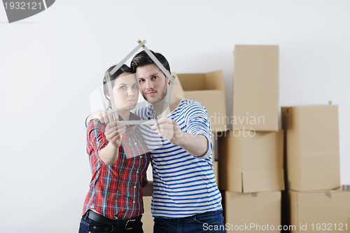 Image of Young couple moving in new house