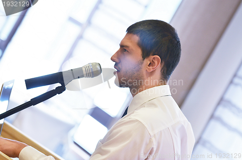 Image of Young  business man giving a presentation on conference