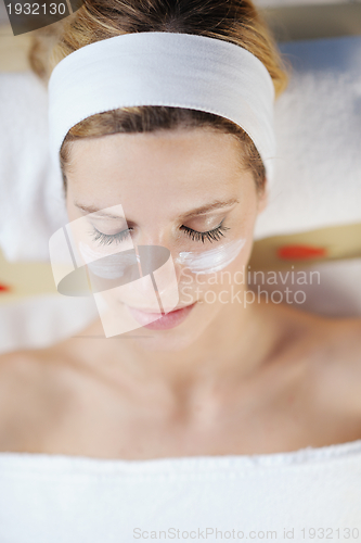 Image of Beautiful young woman in spa