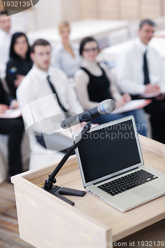 Image of laptop on conference speech podium