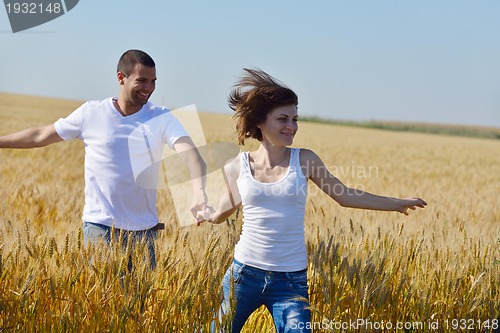 Image of happy couple in wheat field